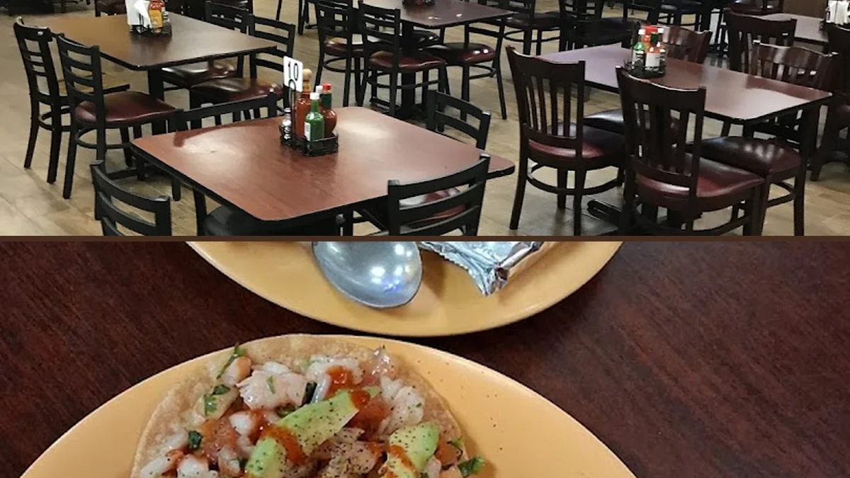 Seafood dishes arranged on a busy restaurant table.