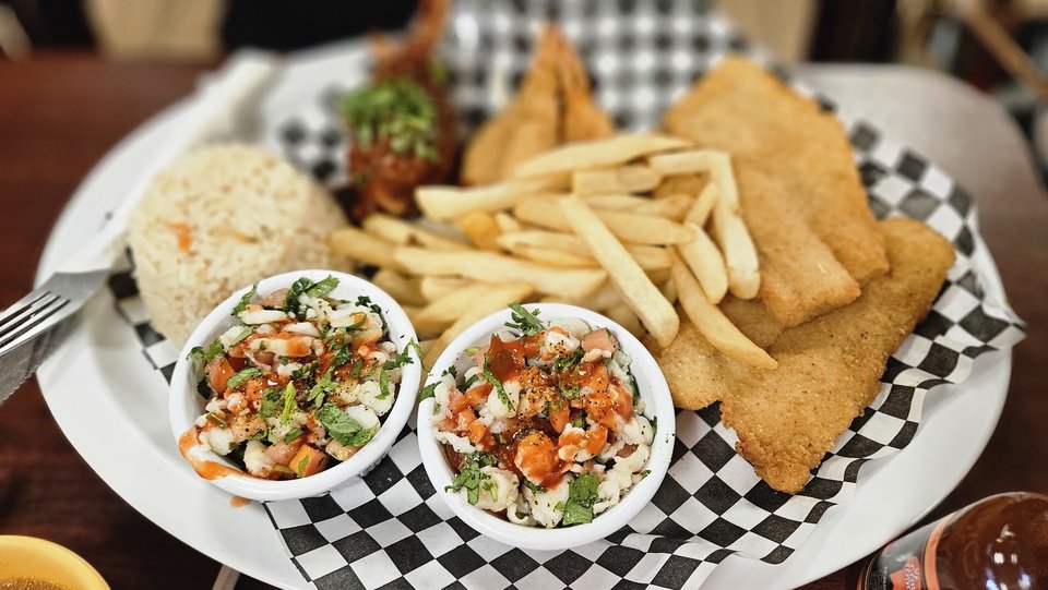 Plates of ceviche with bright citrus accents.
